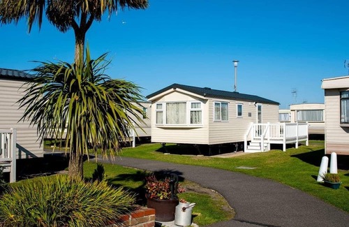 Caister-on-Sea House | Experience comfort and relaxation in our charming caravan, perfect for your next getaway.