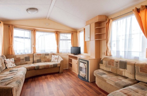 Caister-on-Sea House | Experience comfort and relaxation in our charming caravan, perfect for your next getaway.