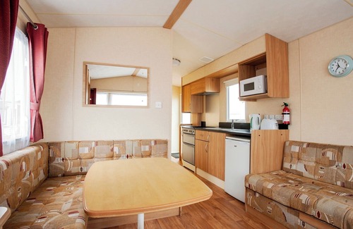 Caister-on-Sea House | Experience comfort and relaxation in our charming caravan, perfect for your next getaway.