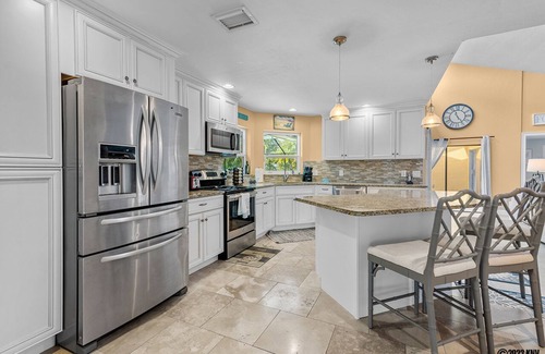 Biggar House | FABULOUS WHISKEY CREEK POOL HOUSE! SLEEPS 8! MINUTES TO GOLF AND GULF!