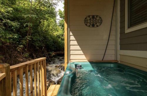 Chalet Village North House | Falling Brook – Cozy Creekside Cabin with Hot Tub, Game Loft & Dog-Friendly Comfort