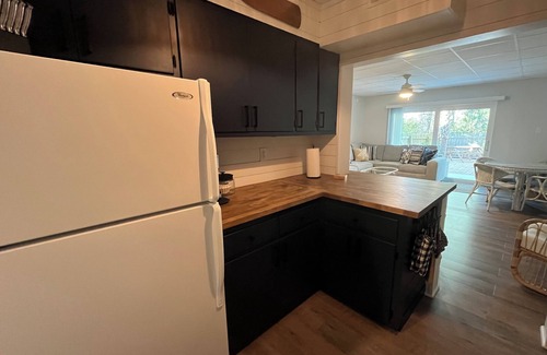 Pensacola Condo | Family Friendly Condo minutes to beach w/large pool and private outdoor space.