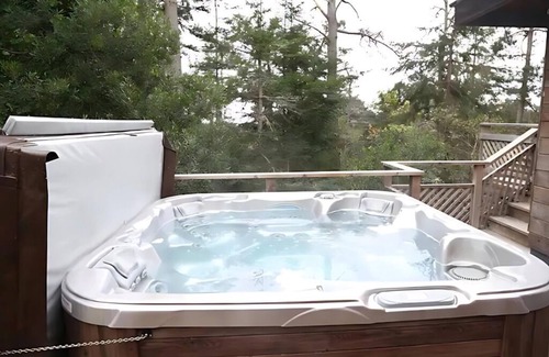 Little River House | Family friendly luxury. wrap-around decks with an ocean view, Spa, and Sauna.