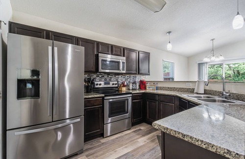 Navarre House | Family Oasis 7 minutes from the Beach. EV friendly