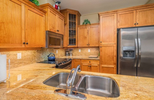 Big White Ski Resort Condo | Family sized cozy ski-in/ski-out retreat w/hot tub and stunning mountain views