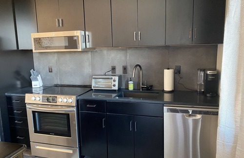 Traverse City Condo | Fantastic Top Floor Condo for 2 in the Heart of Downtown Traverse City W/Parking