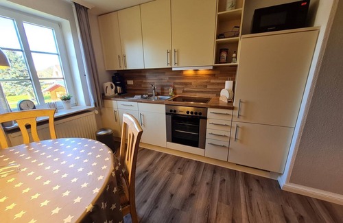 Utersum Apartment | Ferienhaus Ellen, OG Whg. - House Ellen, apartment on the 1st floor