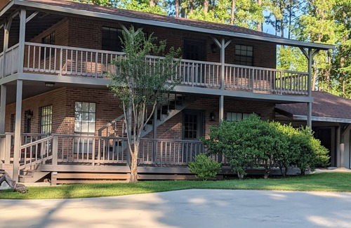 Brookeland House | Fishers Foxhole - two story home with wrap around deck and lake access.