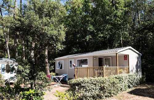 Les Conches House | Flower Camping Les Dunes * - Mobil Home Standard 22m2- 2 bedrooms - Small terrace + TV 4 persons