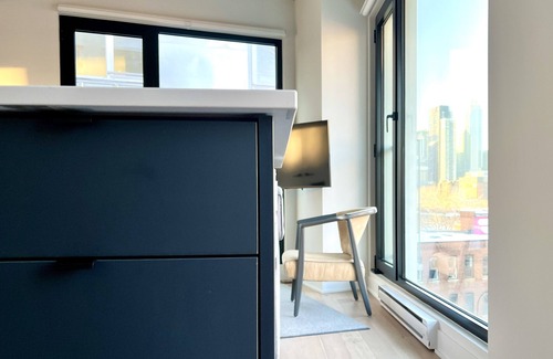 Griffintown Condo | French-scandi canal living: EV/bike parking, gym, pools, rooftop, $133 USD/night