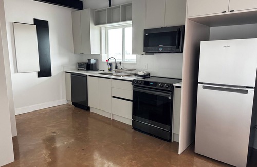 Near East Side Apartment | Fresh & Modern: New Apartment with Rooftop and Stunning Views