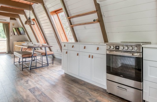 South Beach House | Fully Remodeled, Modern A-Frame Gem with Hot Tub, Deck, and Fire Pit!