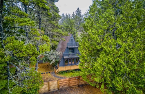 South Beach House | Fully Remodeled, Modern A-Frame Gem with Hot Tub, Deck, and Fire Pit!