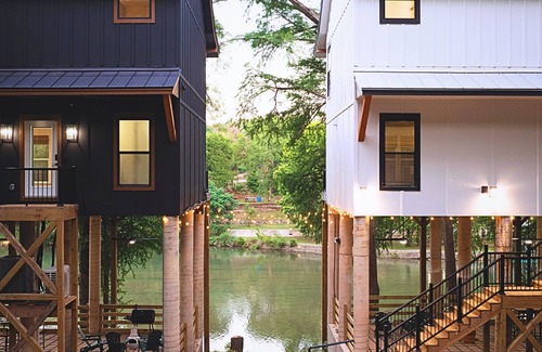 New Braunfels House | Gather, relax, and explore the river. Two side-by-side homes with space for 22 guests, hot tub under the stars, arcade fun, and peaceful water views.