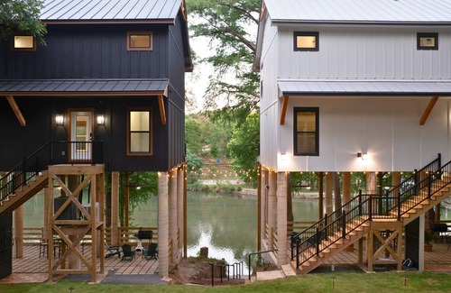 New Braunfels House | Gather, relax, and explore the river. Two side-by-side homes with space for 22 guests, hot tub under the stars, arcade fun, and peaceful water views.