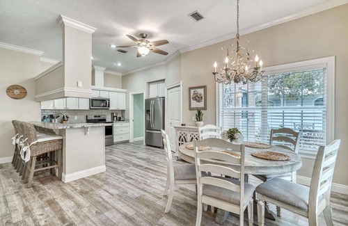 Seacrest House | Giant Backyard Oasis with Heated Private Pool, Fire Pit, and Outdoor Lounge