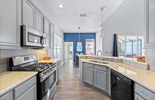 Reunion House | Golf course view - Wood floors, DVR, pool hot tub, movie theatre, resort pools.