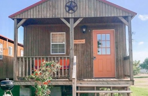 Matagorda Cabin | Gone Coastal is part of a mini resort with pool, bbq area, firepit.