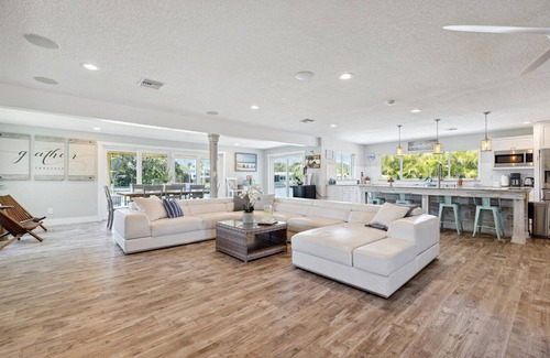 Cocoa Isles House | Gorgeous Private Canal Home w/Heated Pool, Hot Tub & Modern Kitchen - Walk to Restaurants!