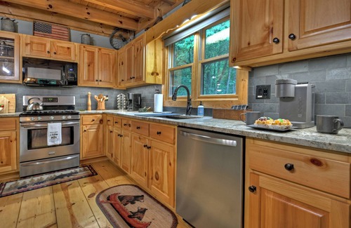 Ellijay Cabin | Gorgeous river front cabin rental with tons of outdoor space, hot tub and firepit