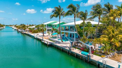 Key Colony Beach House | Grand Blue Arenas with Minigolf, Canal, Game Room, 3 Bedrooms and Heated Pool