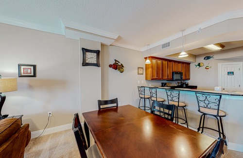 Mexico Beach Condo | Ground-floor condo with ocean view, pool/hot tub access, & private W/D