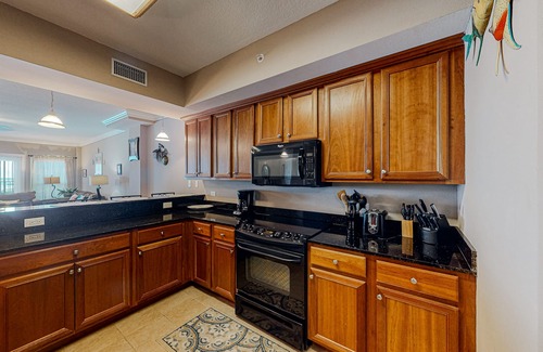 Mexico Beach Condo | Ground-floor condo with ocean view, pool/hot tub access, & private W/D