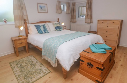 Porthcurno Apartment | GROUND FLOOR THE HAYLOFT, family friendly, with a garden in Sennen