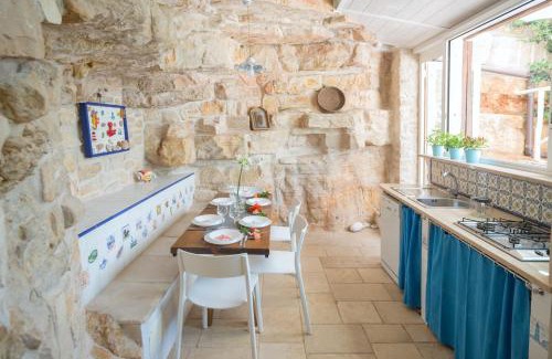 Bisceglie Villa | HelloAPULIA - Sweet Trullo on the Beach - Unique Seafront house with Direct Beach "Ponte Lama" Access and Private Patio