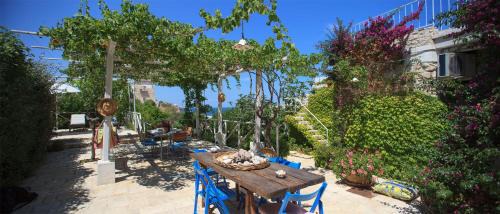 Bisceglie Villa | HelloAPULIA - Sweet Trullo on the Beach - Unique Seafront house with Direct Beach "Ponte Lama" Access and Private Patio