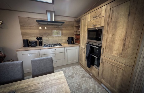 Longridge Cabin | Hobbit - House Of The Owl. Luxury lodge with views. Pet friendly. Indoor Pool.