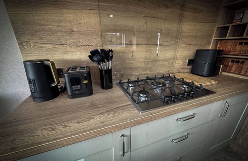 Longridge Cabin | Hobbit - House Of The Owl. Luxury lodge with views. Pet friendly. Indoor Pool.