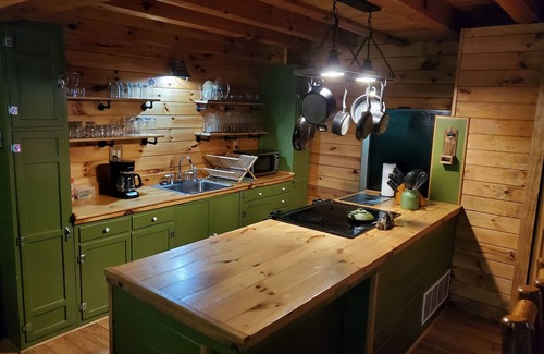 Rockbridge Cabin | Hocking Hills Log Cabin in the Woods facing Rock formation