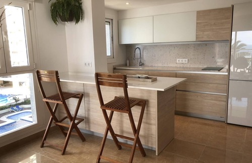 Calpe City Center Apartment | Holiday Apartment 'Front Line on the Beach' with Sea View, Pool, Garden & Wi-Fi