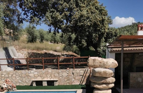 Villanueva de Algaidas House | Holiday Home 'Casa La Pedriza Para 8' with Mountain View, Shared Pool and Wi-Fi