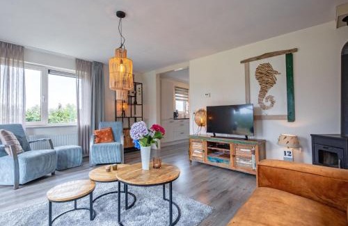Den Burg House | Holiday home near dunes with wellness garden