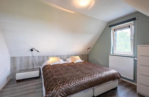 Den Burg House | Holiday home near dunes with wellness garden