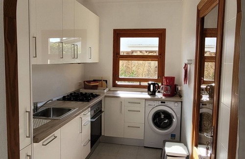 Cala Mandia House | Holiday house with pool and palm trees