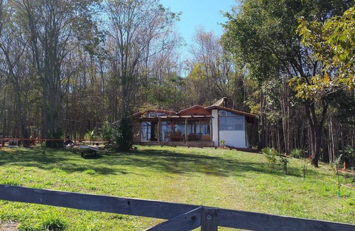 Delfinopolis Cottage | House in the woods, surrounded by the Rio Grande and stunning view of the sunset.