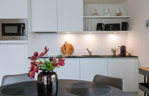 Westende Apartment | Huswell - Spacious top-floor apartment with private parking