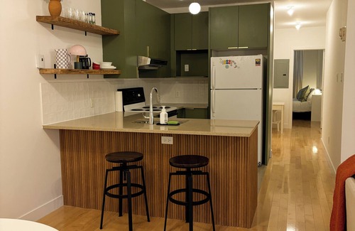 Little Burgundy Condo | Ideal location for long stays. Modern and cozy. Steps to metro, shops, &cafés.