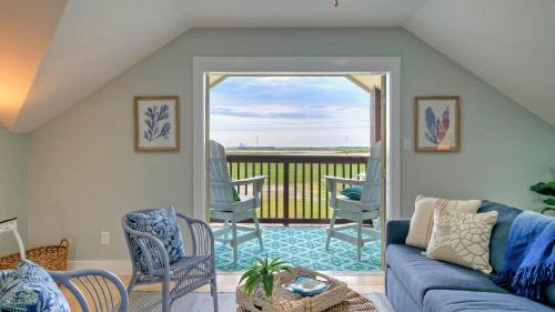Leeward Sands House | Incredible Nature Views Golf Cart for Rent Balcony Blue Crush by AvantStay