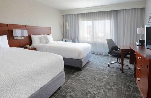North Dallas Hotel | Indulge in Home-Like Comfort! Outdoor Pool, Pet-friendly and Parking!