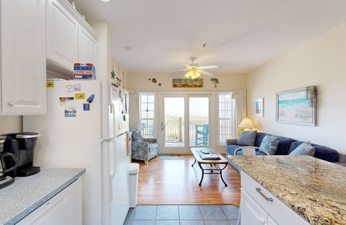 Hatteras Condo | Inviting beachfront condo featuring hot tub & pool, central AC, elevator, & deck