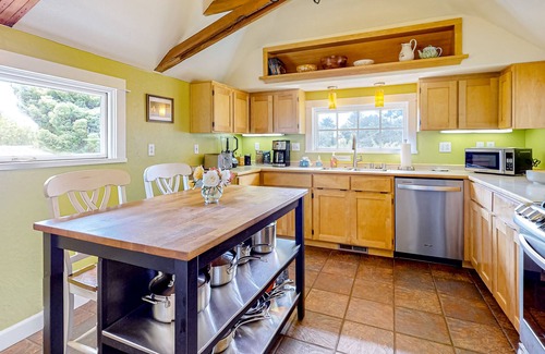 Westhaven-Moonstone House | Inviting home with water view, enclosed yard, hot tub, firepit, & W/D