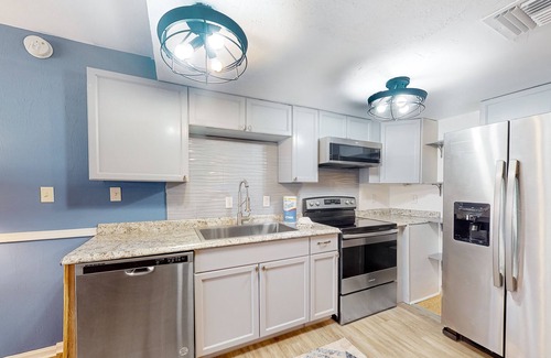 East End House | Inviting townhouse with on-site pool, updated interior, & W/D