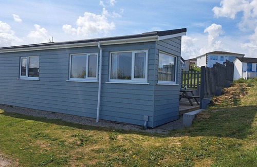 Hayle Apartment | Irene sits amongst the dunes, just a short walk to the three miles of golden, sandy beach below