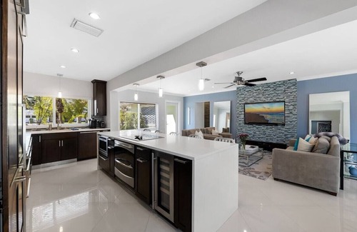 Central Fort Lauderdale House | Just 10min to downtown Ft. Lauderdale & beach, this modern home offers everything a group could want for an upscale relaxing getaway. Unwind in the very private and peaceful backyard oasis, featuring a heated ($) pool, 6-person hot tub & fire pit.