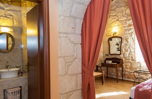 Psarou Villa | Kavos Psarou stone and wooden built sea front sea view traditional/lux villa