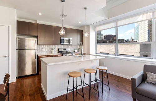 Central Business District Apartment | Kislak 407 Stunning 2BR with Den Corner Apt Retreat Above the City